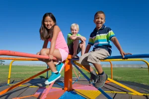 smiling children sitting on a carousel in a park 2026 01 11 09 52 29 utc